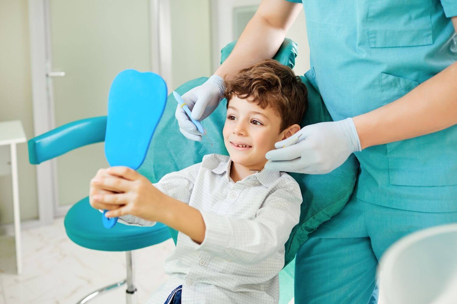 Boy Inspecting Dental Work